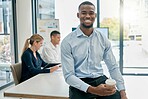 Face portrait, leadership and black man in meeting ready for goals or targets. Ceo, boss and young, happy and confident male entrepreneur with vision, mission and success mindset in company workplace