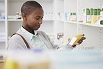 Medicine, search and shopping with black woman in pharmacy for medical, pills and information. Healthcare, product and retail with female customer and box for inventory, wellness and supplements