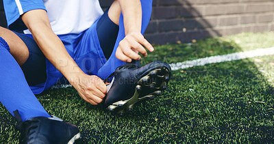 Buy stock photo Hands, person and ready with sneakers on soccer field of game warm up, preparation and sports challenge. Athlete, tie and shoes for football competition, fitness performance and tournament training