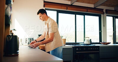 Buy stock photo Man, salad and bowl in kitchen, home and meal prep in profile, happy and vegetables for lunch. Person, chef and smile with food for nutrition, wellness or gut health with organic diet at apartment