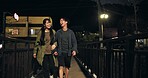 Bridge, couple and happy at night with walking for bonding, exercise routine and fun in Japan. People, relationship and smile or laugh outdoor with funny conversation, joke and comedy on break