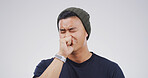 Man, cough and sick college student in studio with chest pain, allergy or respiratory virus on white background. Person, asthma or lung disease with fatigue, mockup space pr cover mouth for illness