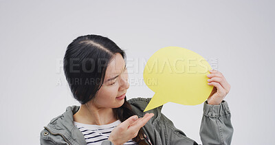 Buy stock photo Social media, speech bubble and woman in studio, feedback and announcement on white background. Opinion, person and model with poster, communication or showing with voice review and information sign