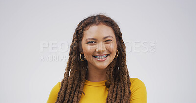 Buy stock photo Portrait, smile and woman with braces for dental care, oral hygiene or wellness on white background. African person, teeth and orthodontics for tooth correction, alignment and health in studio space