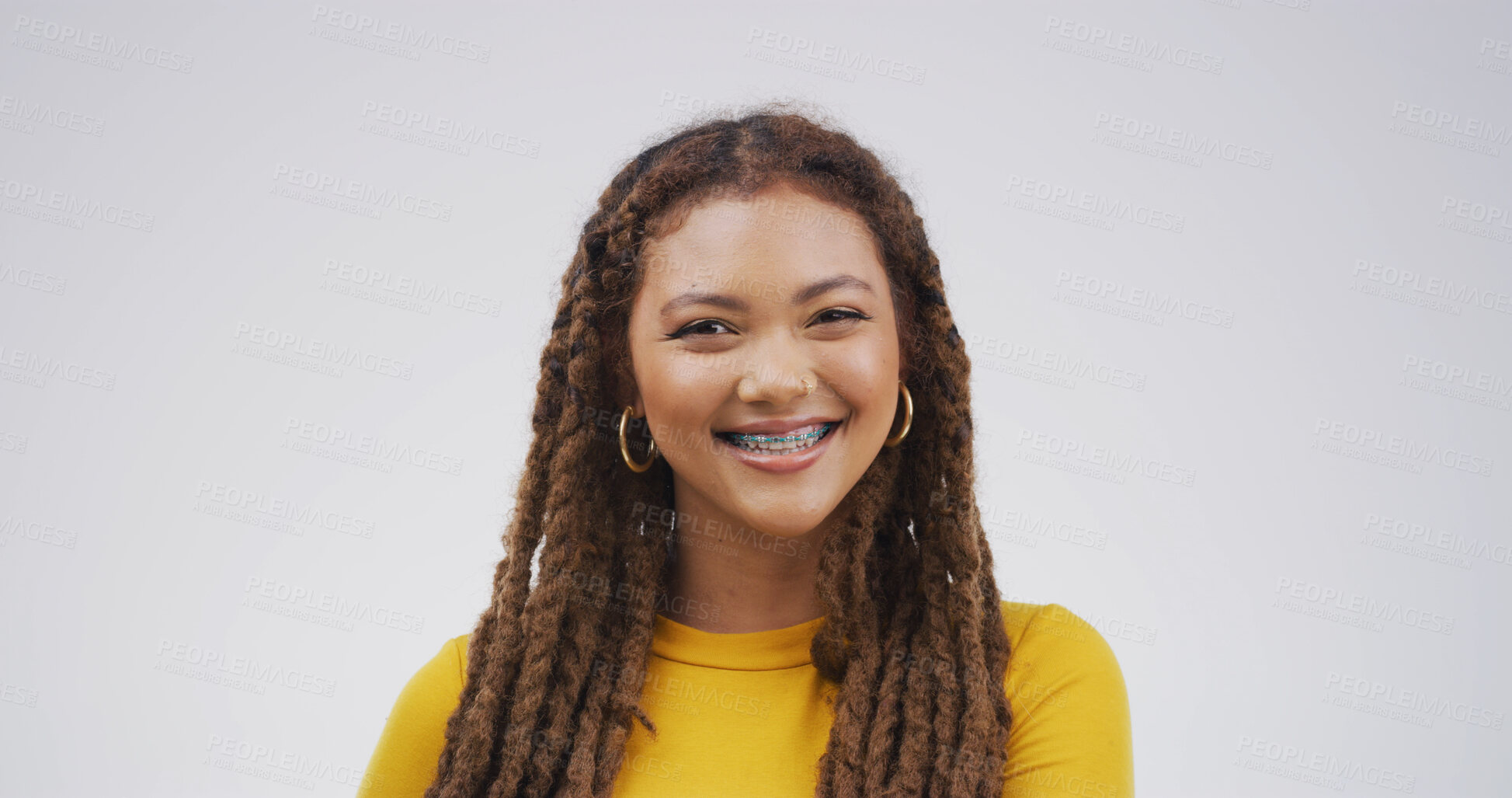 Buy stock photo Portrait, smile and woman with braces for dental care, oral hygiene or wellness on white background. African person, teeth and orthodontics for tooth correction, alignment and health in studio space