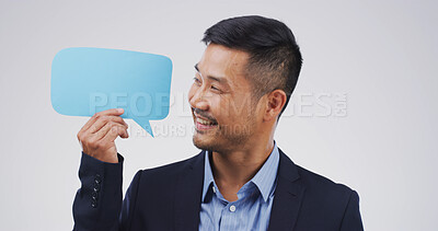 Buy stock photo Speech bubble, mockup space and businessman in studio for announcement, opinion or voice. Happy, social media and Asian male person with text board, blank sign or placard vote by white background.