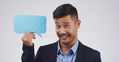 Buy stock photo Business, speech bubble and man with portrait, feedback and announcement on white studio background. Asian person, info sign or model with chatting poster, gesture or promotion with communication