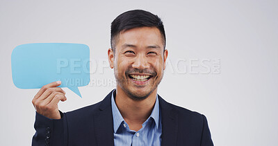 Buy stock photo Business, speech bubble and man with portrait, smile and announcement on white studio background. Asian person, promotion and model with chatting poster, feedback or opportunity with communication