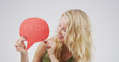 Buy stock photo Smile, woman and icon with speech bubble in studio for announcement, news and signage. Mockup space, person and poster for advertising brand, show information and billboard forum in white background