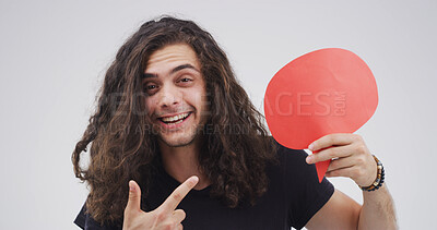 Buy stock photo Speech bubble, pointing and portrait of man in studio with feedback, announcement or vote. Social media, mockup space and person from Portugal with text box, blank sign or placard by white background