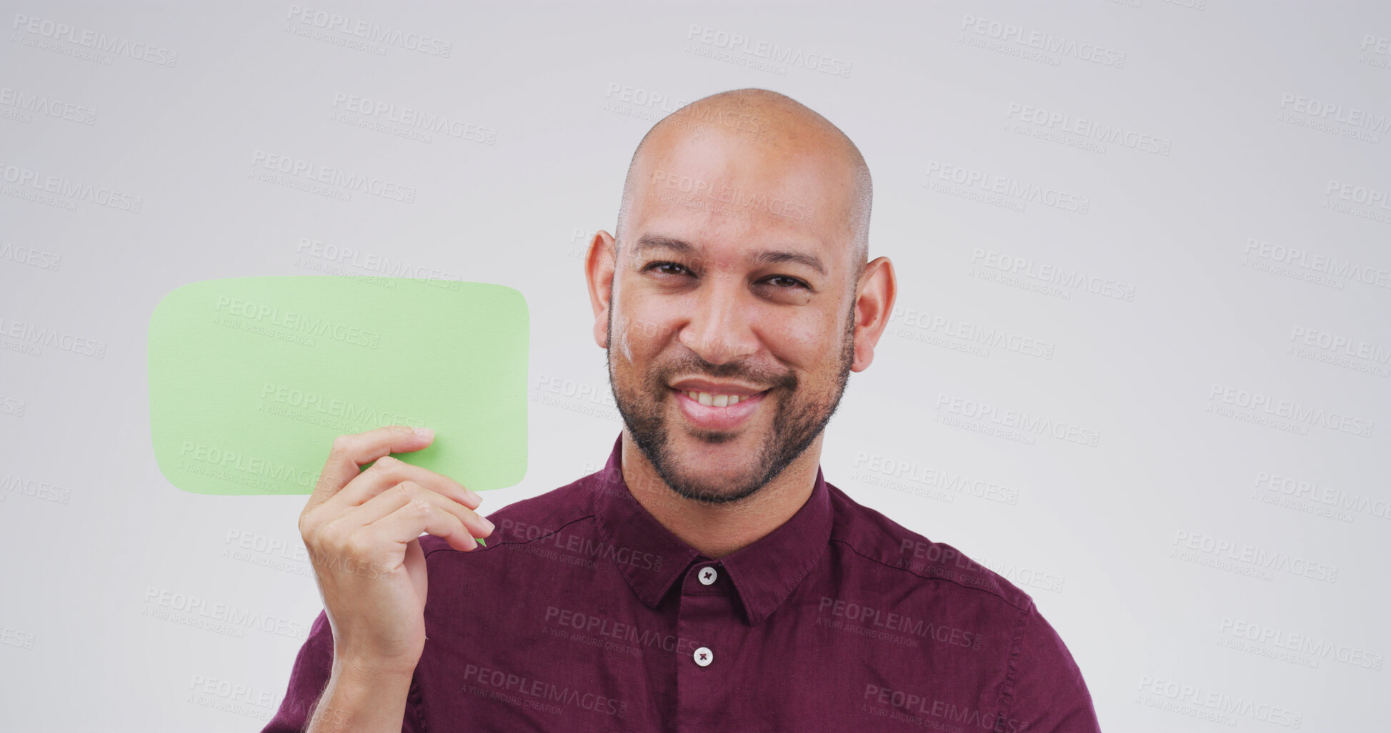 Buy stock photo Man, speech bubble and smile in studio portrait with mock up space, sign and opinion on background. Person, happy and blank poster for marketing, announcement and choice with social media in Mexico