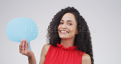 Buy stock photo Portrait, speech bubble and woman in studio, smile and announcement on white background. Person, billboard or model with communication, information sign or voice review with about us or coming soon