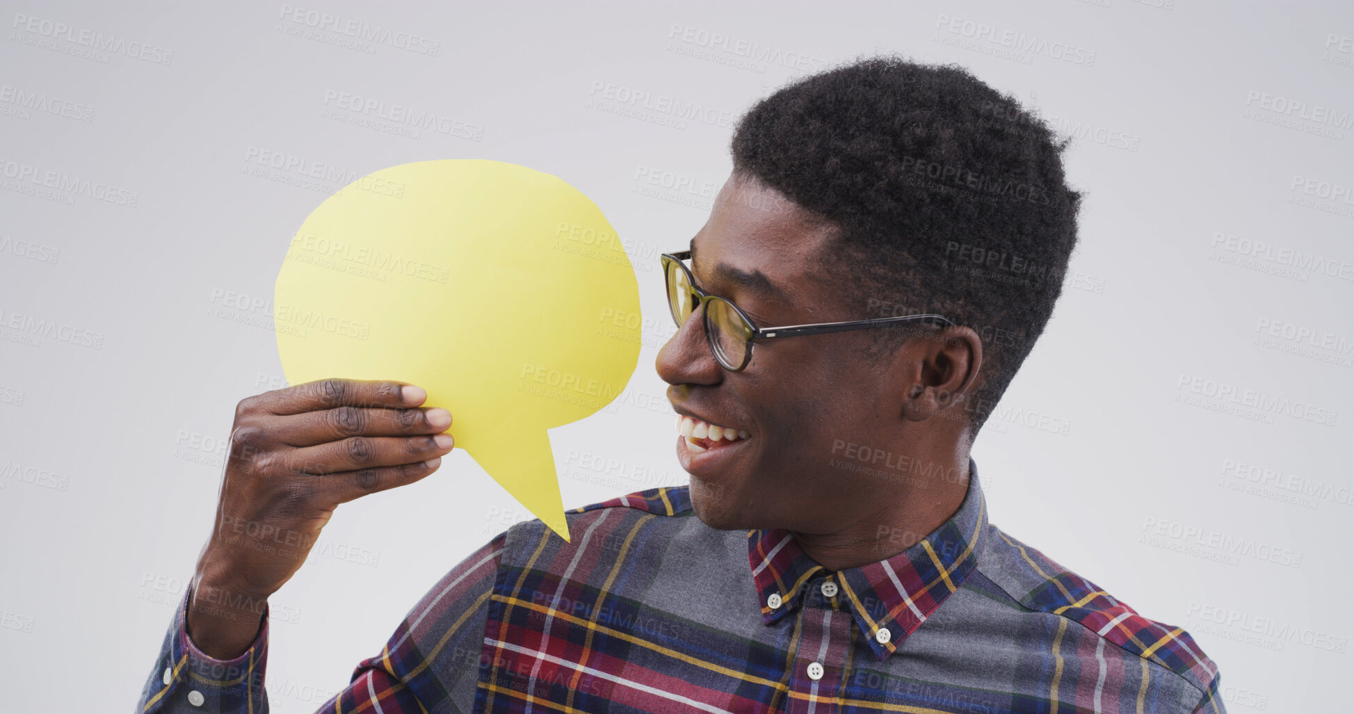 Buy stock photo Happy, black man and social media with speech bubble in studio for chat on white background. Male person, feedback or model with smile, icon or shape for quote, conversation or say with mockup space