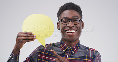 Buy stock photo Black man, speech bubble and point in studio portrait with mockup space, sign and opinion on background. Person, happy and blank poster for marketing, feedback or choice for social media in Nigeria
