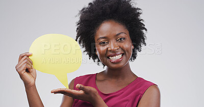 Buy stock photo Speech bubble, mockup space and portrait of black woman in studio with feedback, announcement or vote. Social media, happy and African person with text box, blank sign or placard by white background.