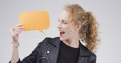 Buy stock photo Happy, speech bubble and woman in studio, feedback and announcement on white background. Smile, person and model with poster, communication or opinion with voice review, information sign or billboard