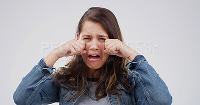 Buy stock photo Depression, crying and portrait of woman in studio for grief, sad and stress on white background. Anxiety, unhappy person and tears for mental health crisis, disaster and mourning with emotional pain