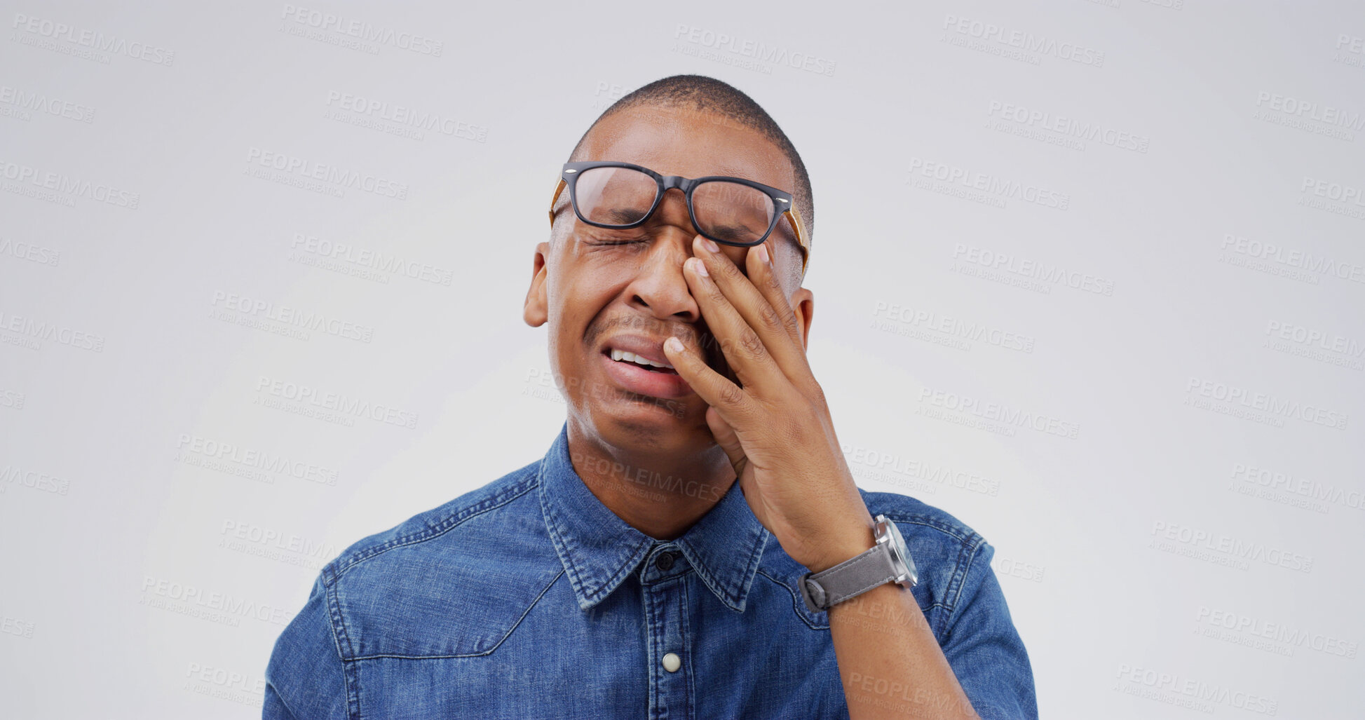 Buy stock photo African man, crying and sad in studio with depression, grief or loss with emotion on white background. Space, tears and crisis with male person in mourning, distress with mental health and unhappy
