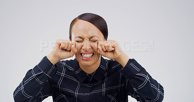 Buy stock photo Woman, crying and sad in studio with stress, mental health or grief for loss on white background. Person, depression and mockup space with broken heart, tears and anxiety with trauma for bad memory