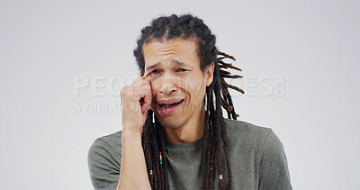 Buy stock photo Tears, sad and portrait of man in studio for depression, heartbreak and crisis. Mental health, overwhelmed and crying with frustrated person on white background space for shame, mistake and emotional
