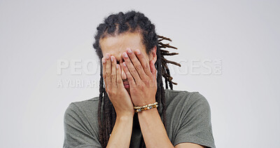 Buy stock photo Embarrassed, news and worry with hands on man in studio for debt crisis, challenge and gambling addict. Lottery mistake, mental health and finance loss with person on white background space for fail