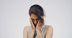 Sad woman, stress or crying with emotion in studio for mistake or depression on a white background. Female person, model or disaster with anxiety or mental health for abuse or sadness on mockup space