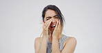 Sad woman, crying and emotion with grief in studio for mistake or depression on a white background. Female person, model or breakup with sob or mental health for stress, loss or crisis on space