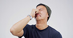 Sad man, stress or crying with emotion in studio for mistake or depression on a white background. Male person, model or disaster with breakup, sob or mental health for bad news, breakdown or divorce