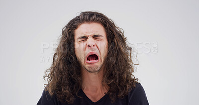 Buy stock photo Sad man, crying and mistake with emotion for breakup in studio on a white background. Male person, upset or model moping with sob, stress or expression for divorce, mental health or bad news on space