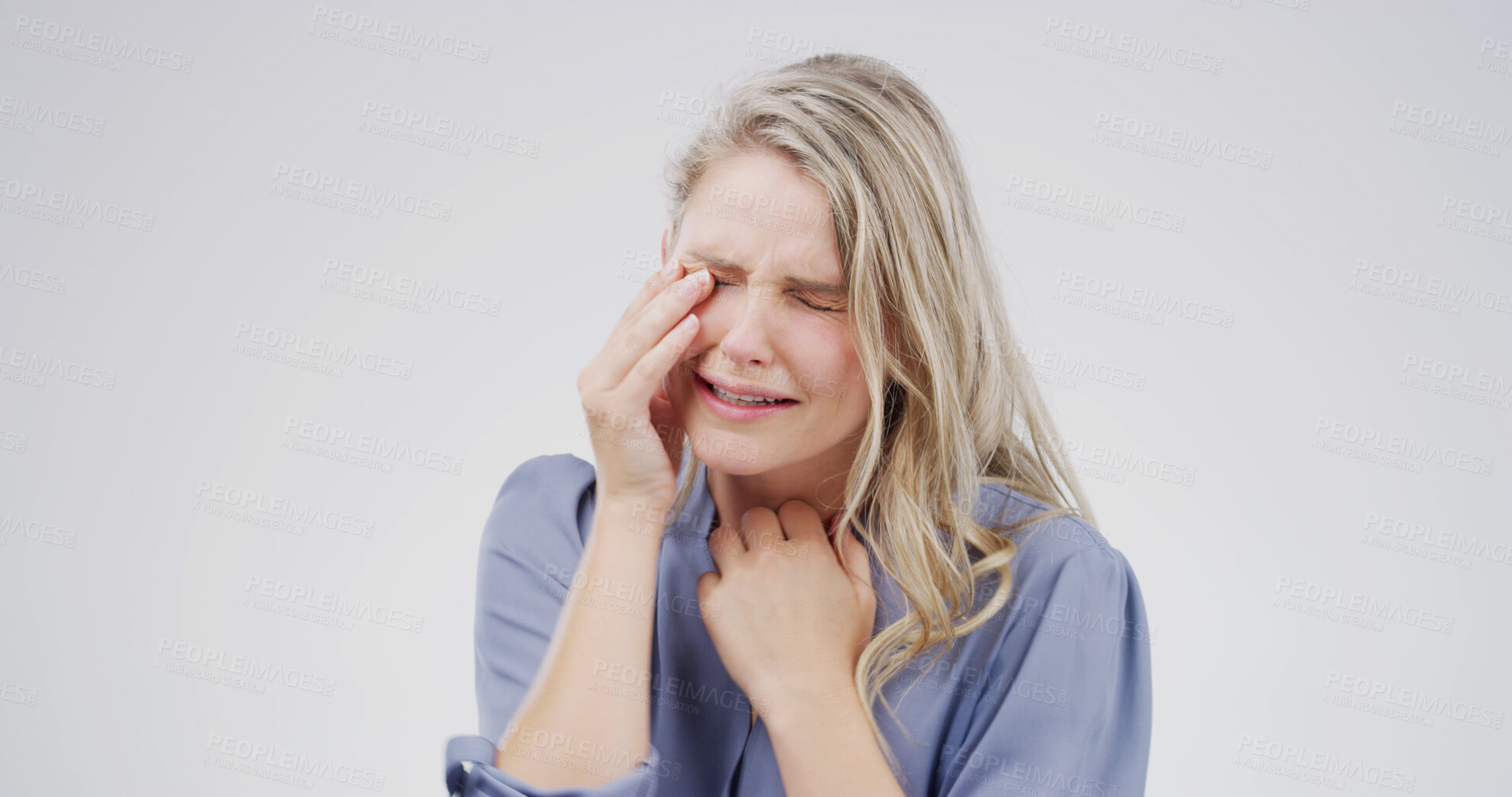 Buy stock photo Sad woman, crying and mental health in studio with grief, wipe tears or stress for loss on white background. Person, depression and mock up space with broken heart, frustrated and anxiety with trauma