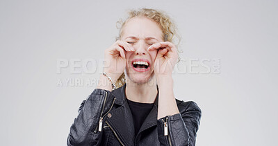Buy stock photo Girl, crying and sad in studio with depression, grief or loss with emotion on white background. Space, tears and crisis with female person in mourning, distress with mental health and unhappy