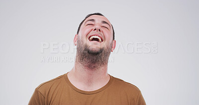 Buy stock photo Laugh, happy and face of man in studio with funny joke, humor and comedy on white background. Emoji, confidence and isolated person with laughter for positive attitude, cheerful and joy for comic
