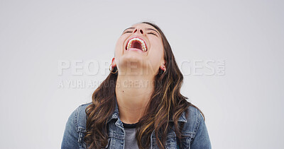 Buy stock photo Laughing, funny and comedy with woman in studio for comic expression, joke and goofy. Positive mindset, happiness and meme reaction with person on white background space for humor and good mood