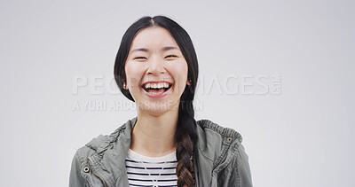 Buy stock photo Laughing, student and Asian woman with pride, portrait or smile for opportunity to learn and studio. White background, happy or person with reaction to funny joke, humor and scholarship in university