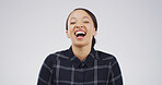 Portrait, smile and woman laugh in studio with expression, funny joke and reaction to meme. Happy, female person and humor with positive attitude, good vibes and silly emotions on white background 