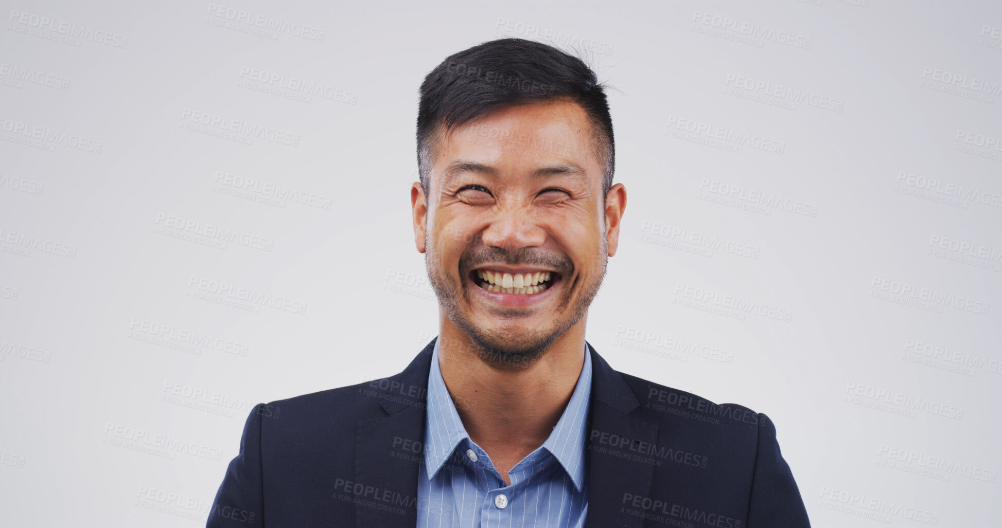 Buy stock photo Comedy, funny and humor with business man in studio for expression or reaction to joke and meme. Comic, laughing and space with happy employee isolated on white background for positive motivation