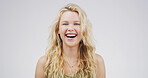 Portrait, woman and laughing in studio for comedy, funny joke and reaction to meme. Happy, female person and goofy humor with positive attitude, good vibes and silly expression on white background 