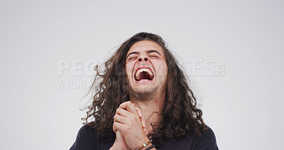 Buy stock photo Winner, laugh and man in studio for celebration, success or clapping on white background space. Excited, funny person and cheering for lottery prize, goal achievement and promotion with reward