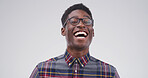 Funny, laugh and black man in studio with glasses for comedy, euphoria or good vibes. Excited, smile and male person with happiness, comic news and crazy expression on white background with space