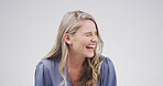 Funny, laugh and woman in studio for comedy, goofy joke or good vibes on white background with space. Excited, smile and female person with happiness, comic news and crazy expression for humor
