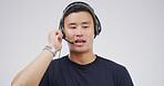 Man, talking and headset in studio for telemarketing, sales pitch and insurance advice in call center. Agent, tech and communication on white background for consultation, business contact us and CRM