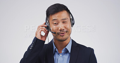 Buy stock photo Customer support, talking and face of Asian man in studio for virtual help, contact us and networking. Mockup space, call center and person with headset for consulting service on white background