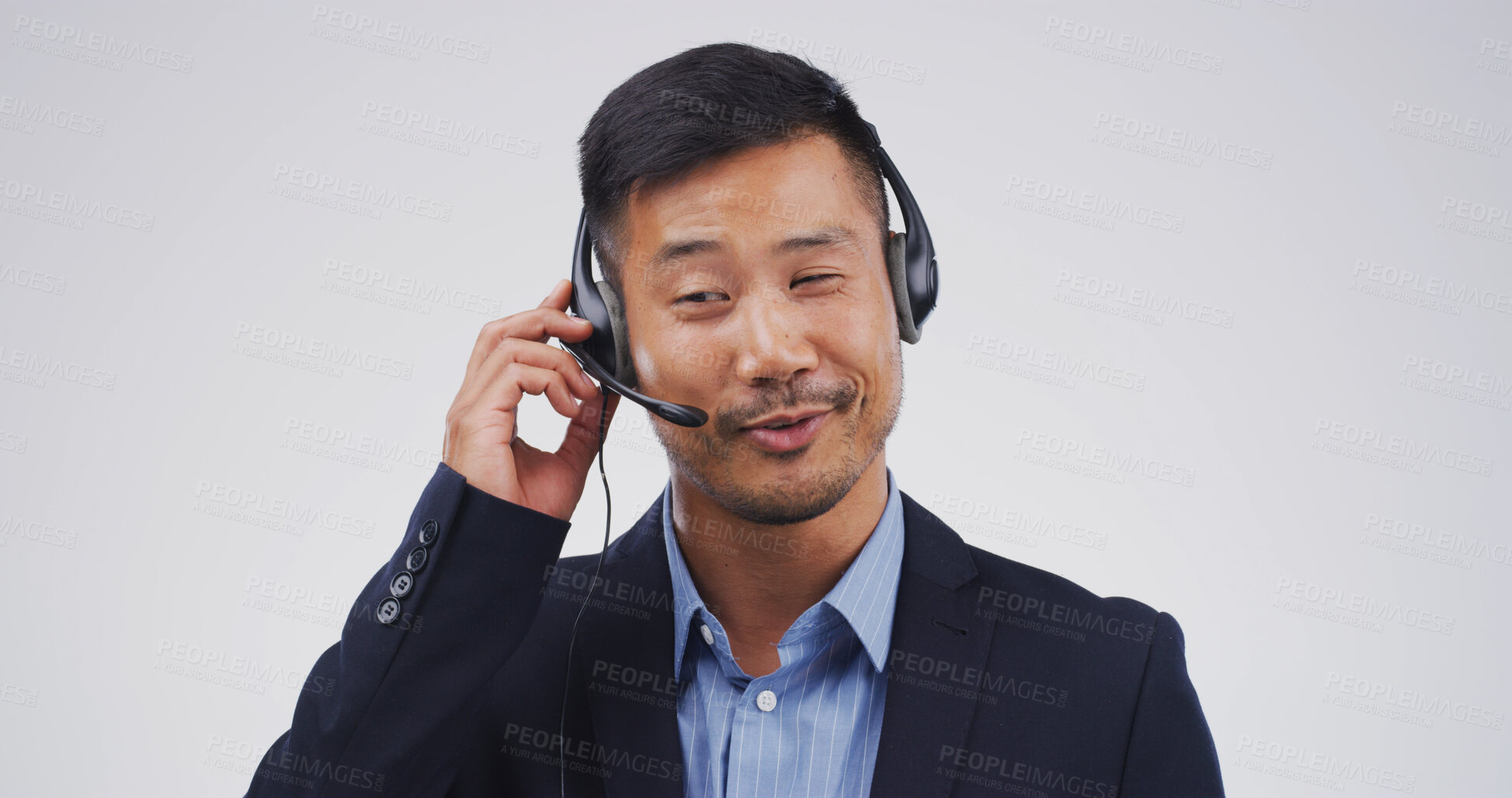 Buy stock photo Customer support, talking and face of Asian man in studio for virtual help, contact us and networking. Mockup space, call center and person with headset for consulting service on white background