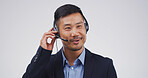 Customer service, agent and talking on headset in studio for inbound inquiry, help or assistance. Mockup, asian man or call center support for product knowledge, FAQ or contact us on white background
