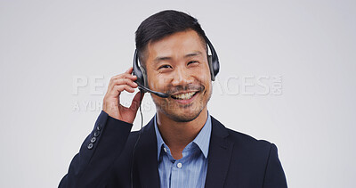 Buy stock photo Call center, portrait and man with microphone in studio for product advice, order processing or CRM. Mockup, telemarketing and happy agent on white background for inbound inquiry or online assistance