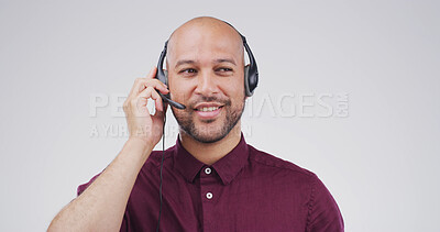 Buy stock photo Call center, microphone and listening with man in studio for customer support, contact us and crm. Virtual advisor, consultant and headset with person on white background space for help desk agent