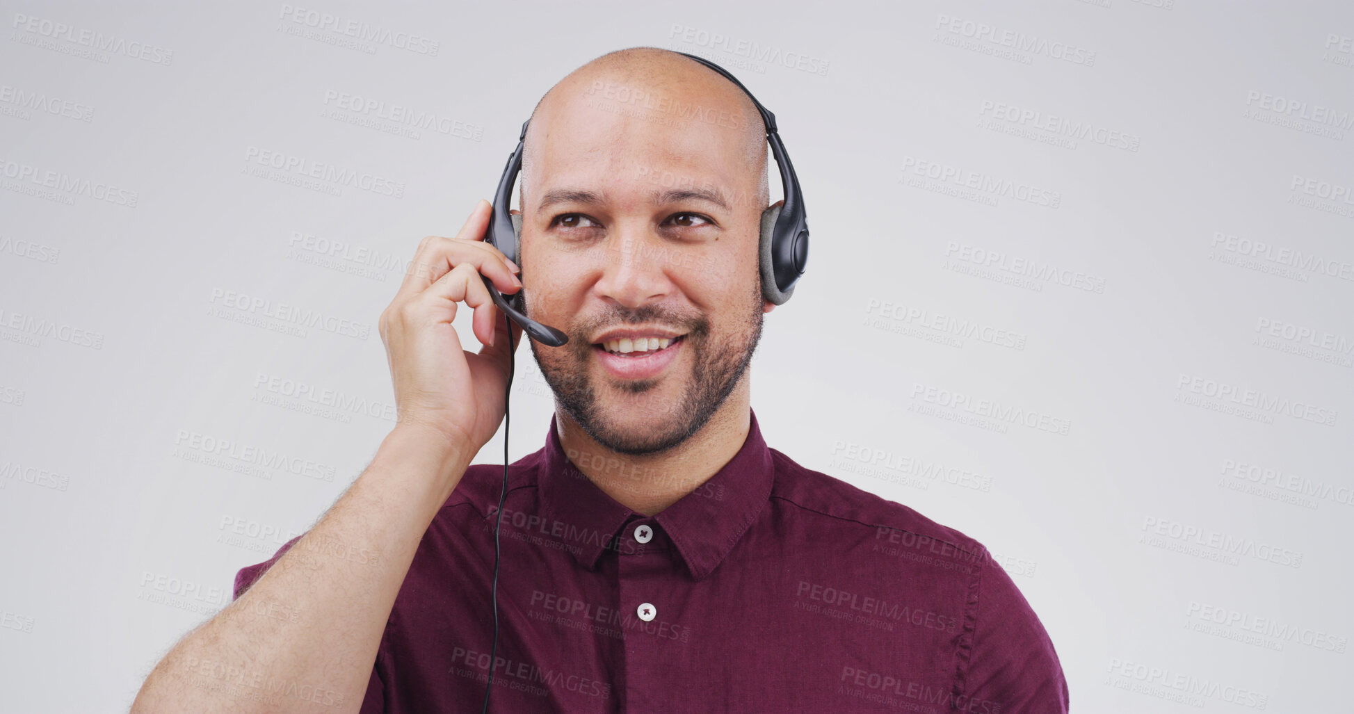 Buy stock photo Call center, man and talking on microphone in studio for lead generation, product knowledge or CRM. Mockup, friendly agent and speaking to client for online sales or telemarketing on white background
