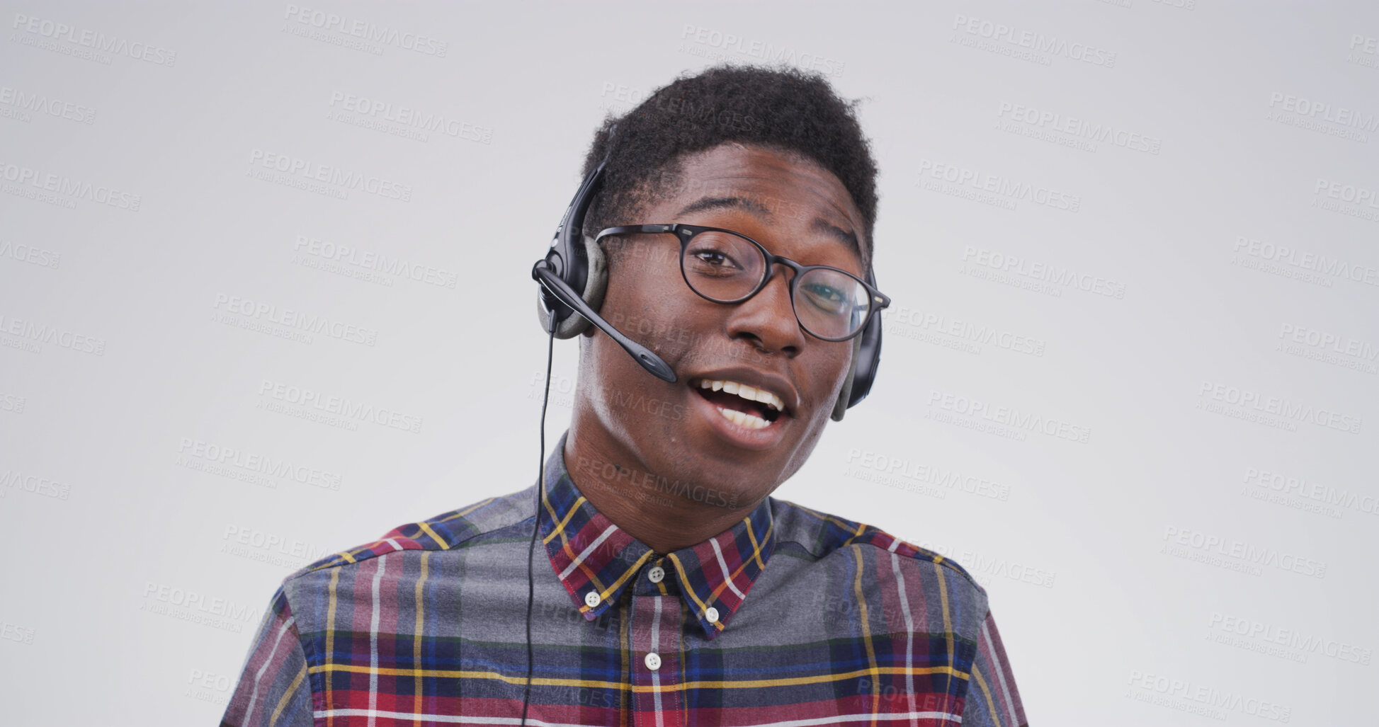 Buy stock photo Black man, portrait and headset in studio for consultation, help or online language course at space. Tutor, glasses or tech on white background for teaching, vocabulary lesson or call center in Kenya