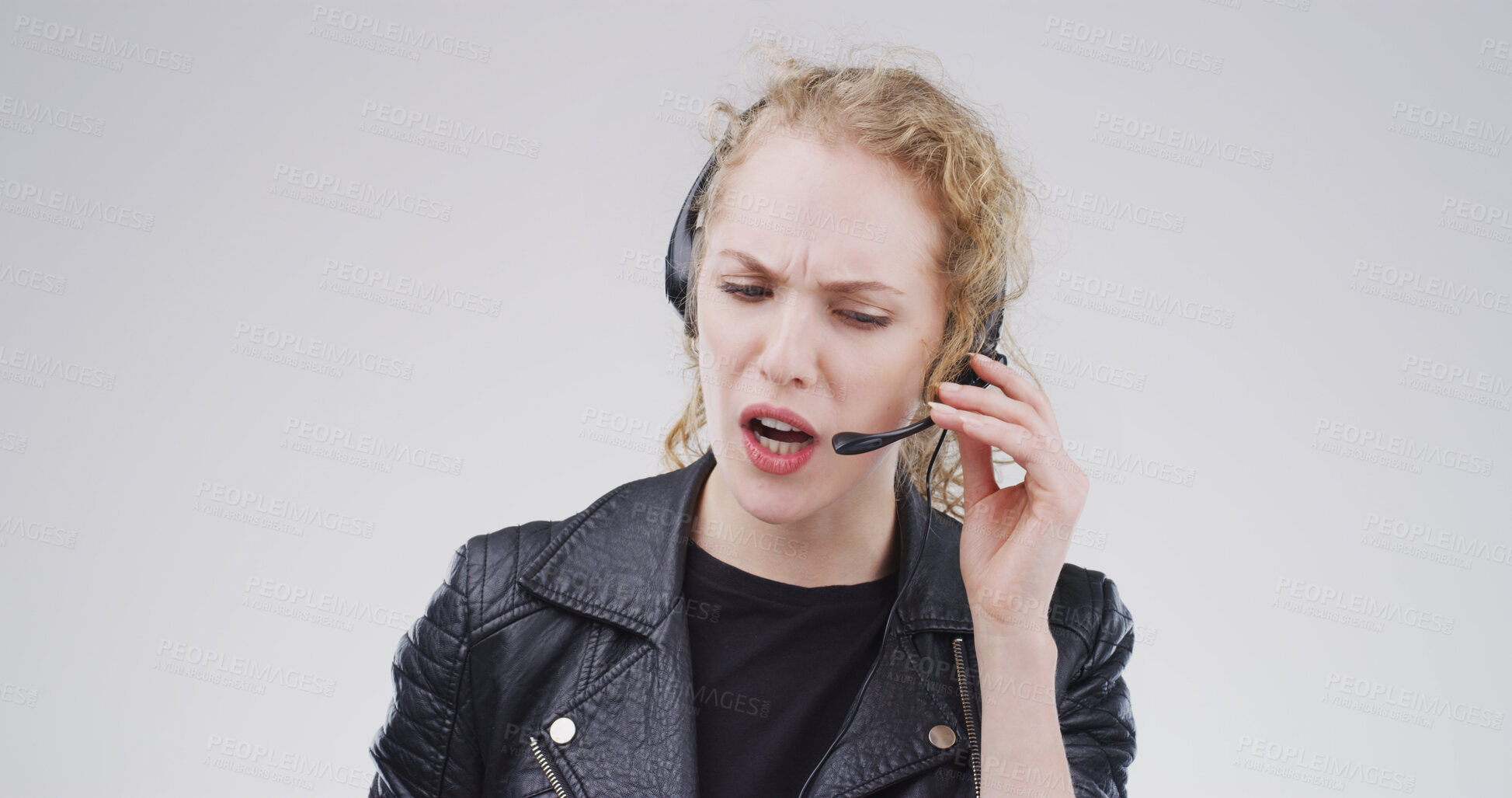Buy stock photo Business, call centre and woman in studio, stress and customer support on white background. Person, employee or consultation with help desk, conversation and angry with feedback, upset and mistake