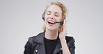 Happy, woman and headset at call centre in studio for consultation, funny client and contact us. Advisor, laughing and mic for customer service, advice and listening to comic joke on white background